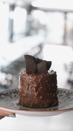 Elegant Layered Cake on a Rustic Wooden Tableの写真素材