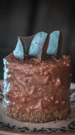 Elegant Layered Cake on a Rustic Wooden Tableの写真素材