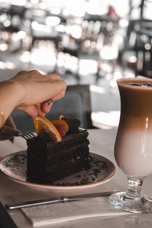 Chocolate Drip Cake with Berries and Flowersの写真素材
