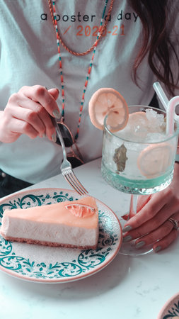Colorful Fruit Topped Cake on White Backgroundの写真素材
