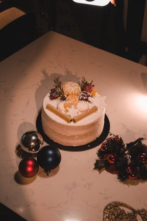 Elegant Layered Cake on a Rustic Wooden Tableの写真素材