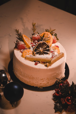 Colorful Fruit Topped Cake on White Backgroundの写真素材
