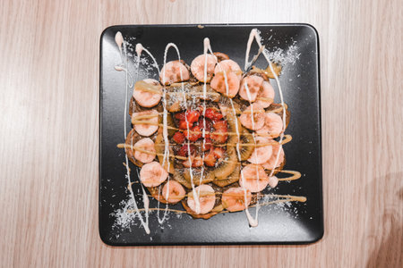 Delicious waffles with chocolate sauceの写真素材