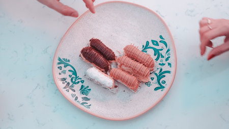 Chocolate dipped eclairsの写真素材