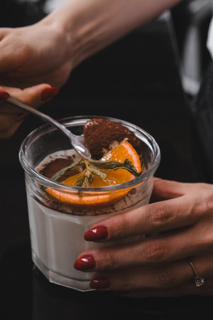 Delicious profiteroles with chocolate on the tableの写真素材