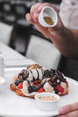 Delicious waffles with chocolate sauce