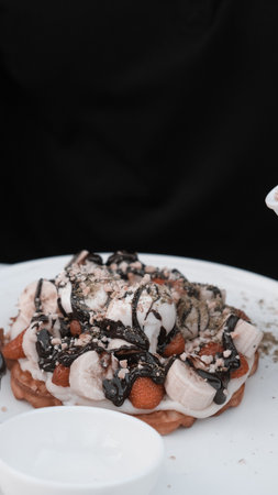 Delicious waffles with chocolate sauceの写真素材