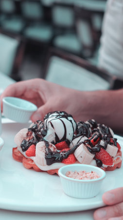 Delicious waffles with chocolate sauceの写真素材