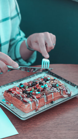 Delicious waffles with chocolate sauceの写真素材