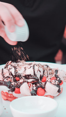 Delicious waffles with chocolate sauce