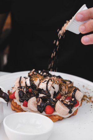 Delicious waffles with chocolate sauce