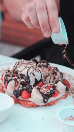 Delicious waffles with chocolate sauceの写真素材