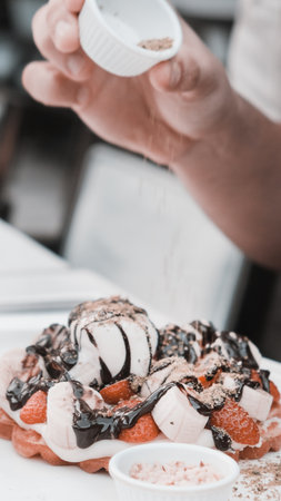 Delicious waffles with chocolate sauceの写真素材