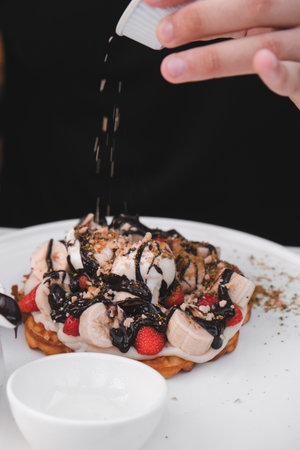 Delicious waffles with chocolate sauceの写真素材