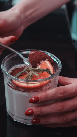 Delicious profiteroles with chocolate on the tableの写真素材