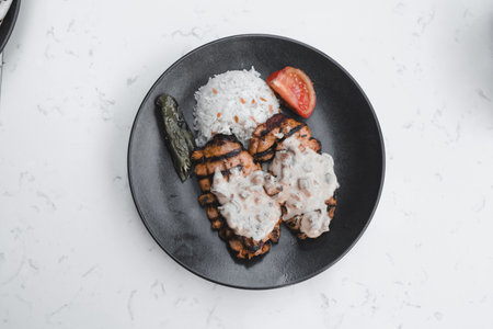 A juicy bite of chicken with every forkfulの写真素材