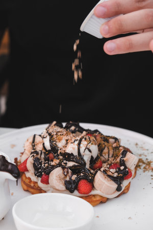 Delicious waffles with chocolate sauce