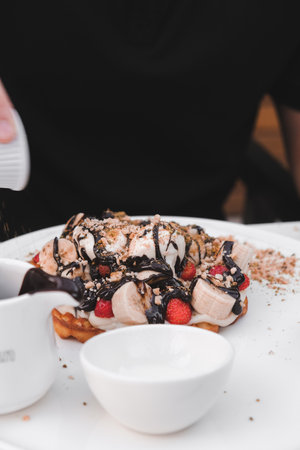 Delicious waffles with chocolate sauceの写真素材