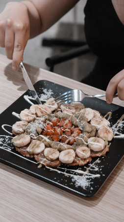 Delicious waffles with chocolate sauceの写真素材