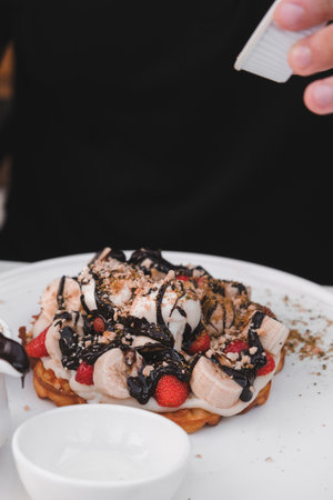 Delicious waffles with chocolate sauceの写真素材