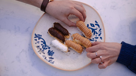 Decadent chocolate covered eclair, a true treatの写真素材