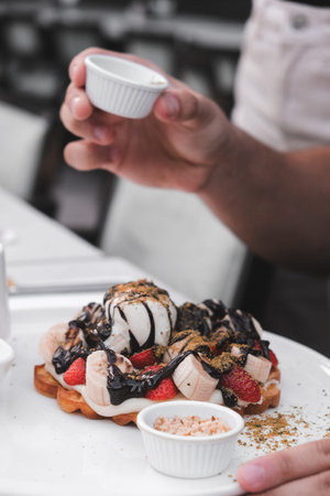 Delicious waffles with chocolate sauce