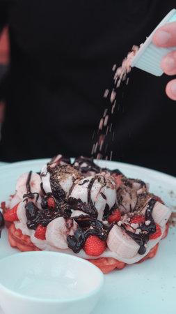 Delicious waffles with chocolate sauceの写真素材