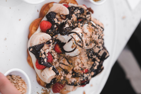 Delicious waffles with chocolate sauceの写真素材