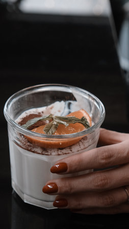 Delicious profiteroles with chocolate on the tableの写真素材