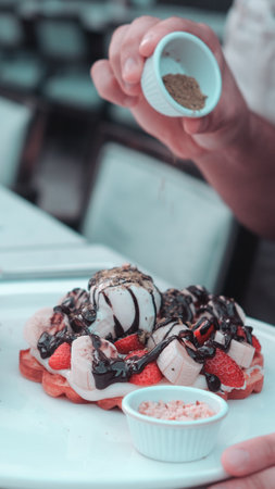 Delicious waffles with chocolate sauceの写真素材