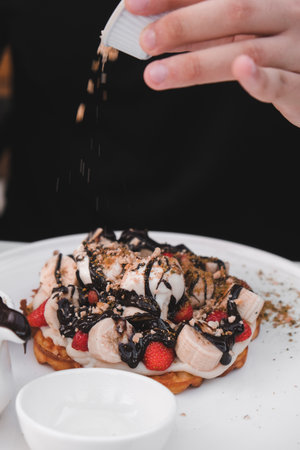 Delicious waffles with chocolate sauceの写真素材