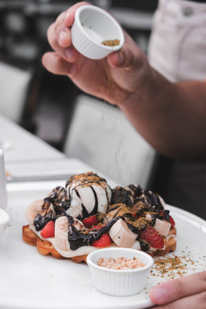 Delicious waffles with chocolate sauceの写真素材