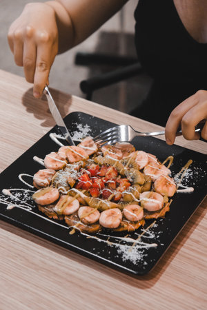 Delicious waffles with chocolate sauceの写真素材