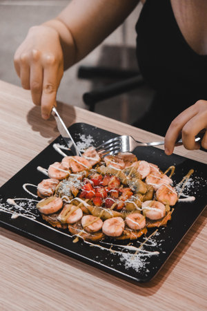 Delicious waffles with chocolate sauceの写真素材