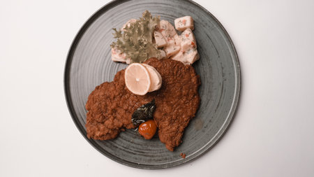 Delicious schnitzel served with french friesの写真素材