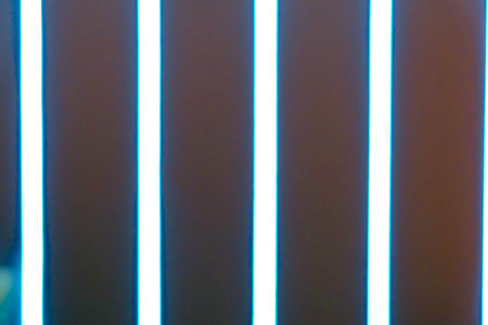 Abstract blue and white neon light lines on the wall. Abstract background.の写真素材