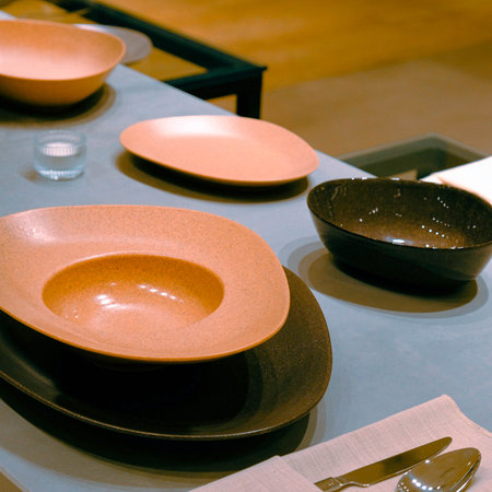 Ceramic tableware on a table in a restaurant or cafeの写真素材