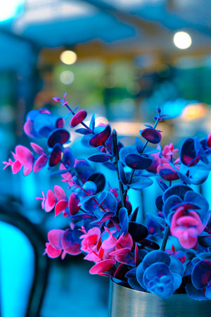 Beautiful flowers in vase on table, closeup of photoの写真素材