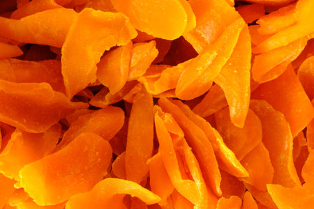 Close up of dried mango slices, top view.