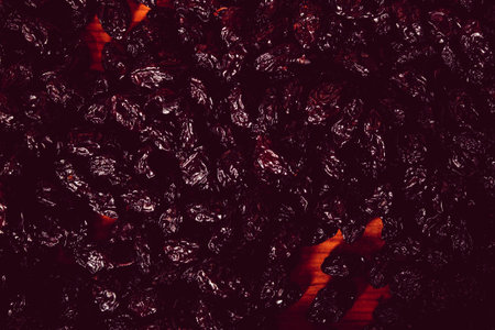 Dried fruit on a dark wooden background. top view