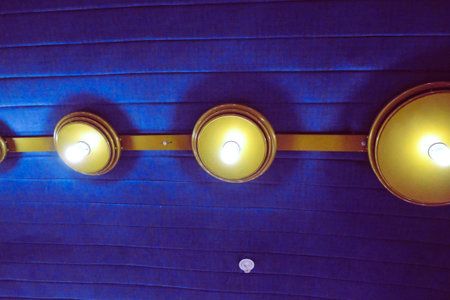 lamps on a blue background in a restaurant, closeup of photo