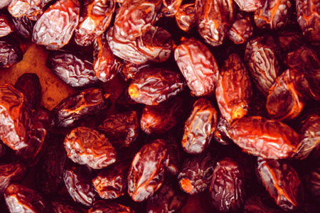 Dried fruit dates as a background. top view Toned.