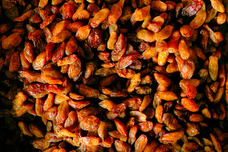 Dried raisins in the market, closeup of photo