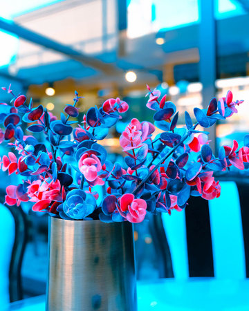 Flowers in a vase on the table in the cafe.