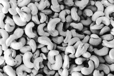Roasted cashew nuts background. Black and white. top viewの写真素材
