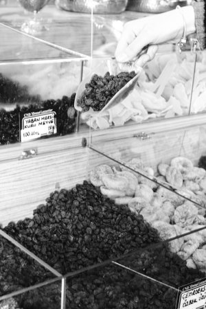 Black and white photo of dried fruits in a shop window in Istanbulの写真素材