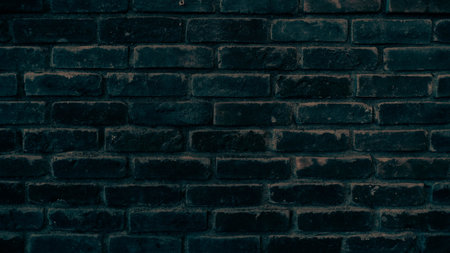 Old black brick wall texture background. Close up of dark brick wall.