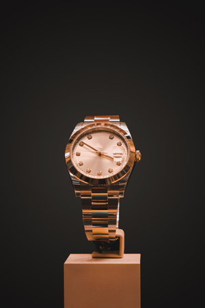Wristwatch on stand isolated on black background with clipping path.の写真素材