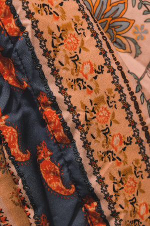 Background texture, pattern. Silk fabric is brown with a floral pattern.の写真素材