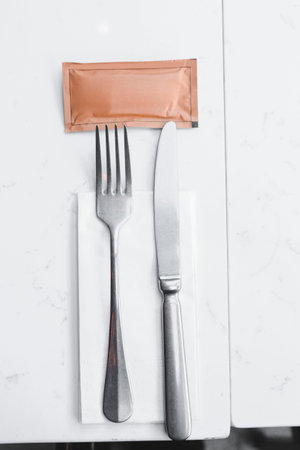 Fork and knife on table in restaurant - Filter effect processing style pictures